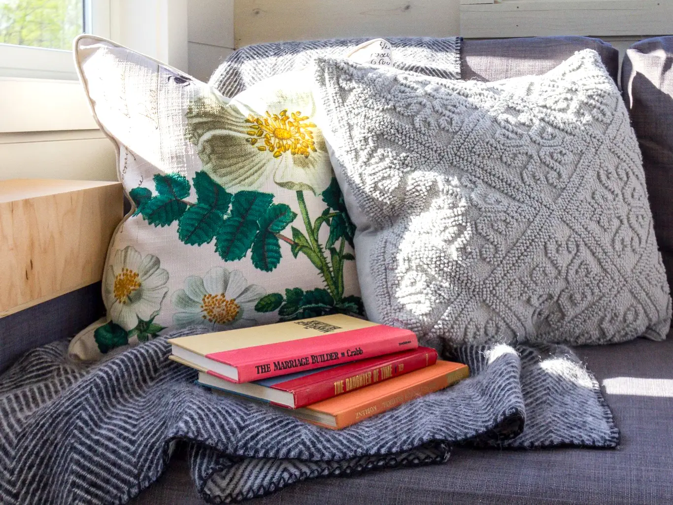 Zipped fabric pouch holding a book